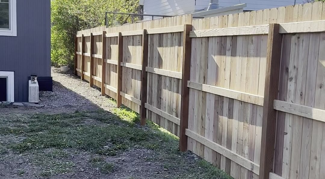 Cedar privacy fence running along the side yard