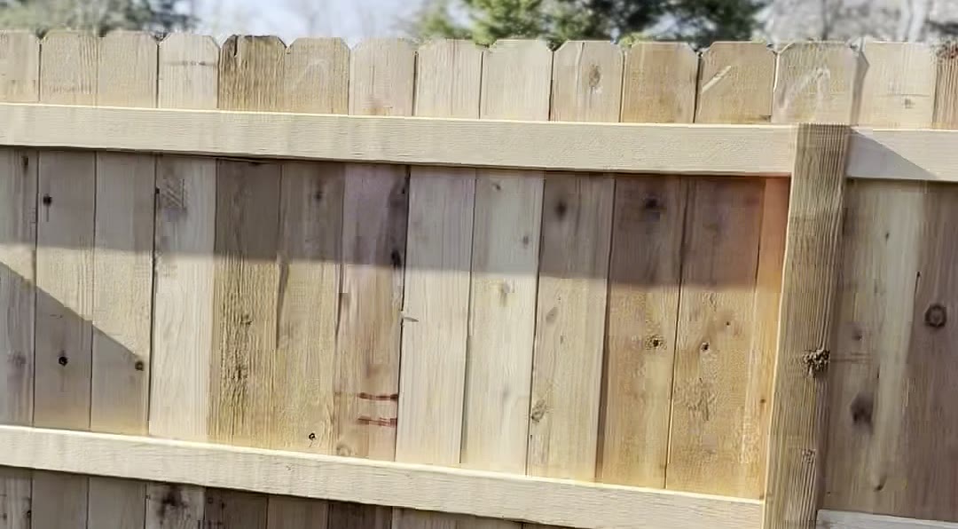 Close-up of cedar fence pickets and rails