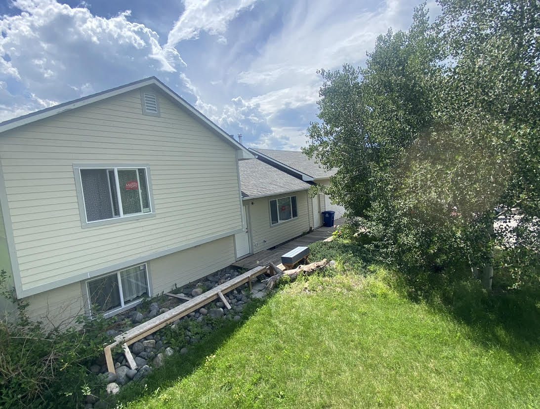 House exterior with new lap siding and windows